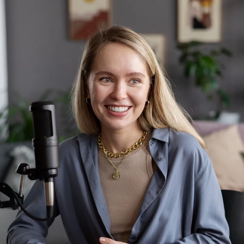 Podcaster smiling to camera